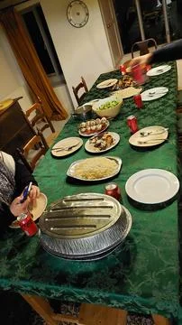 Crowded Dinner Table: Shared Meal, Social Gathering, Festive Feast Stock Photos