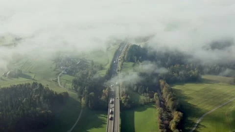 Crowded highway in cinematic scenery of clouds and forest Stock Footage 167554500