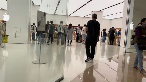 Crowded Interior of a Modern Minimalist Tech Retail Store with Shoppers Stock Footage 335923724