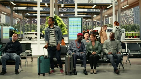 Crowded interstate bus terminal with diverse passengers seated before trip Stock Footage 334725131