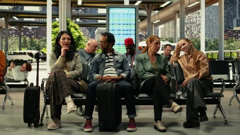 Crowded interstate bus terminal with diverse passengers seated before trip Stock Footage 334727023