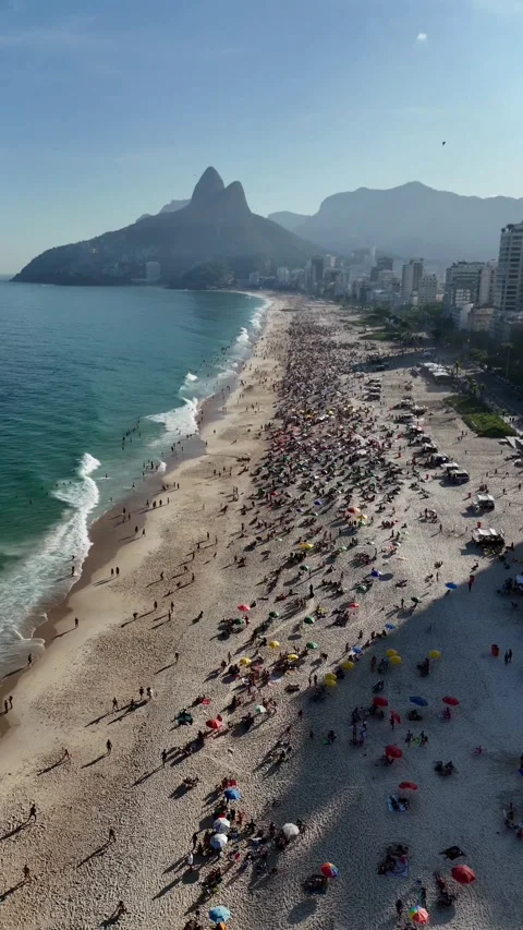 Crowded Ipanema Beach with Mountain Backdrop Stock Footage 312766456