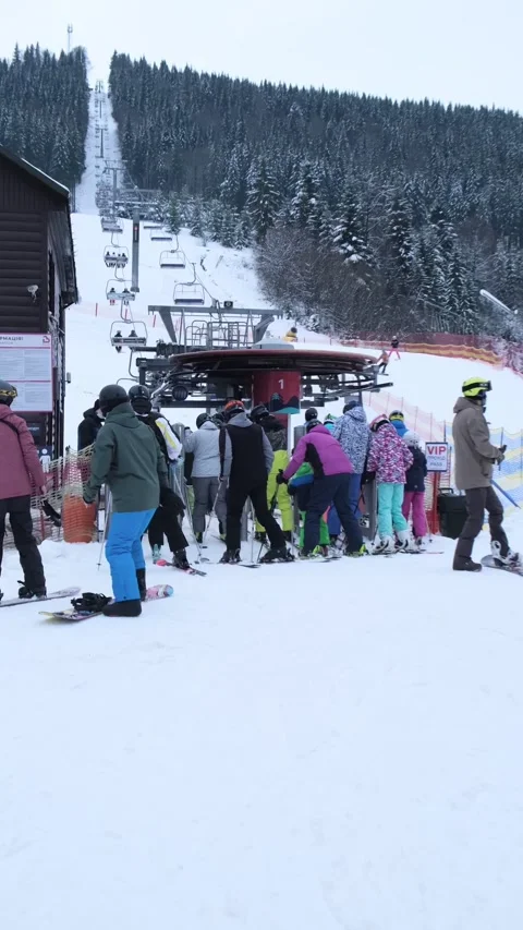 Crowded line in front of ski resort chair lift Stock Footage 209907822