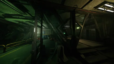 Crowded mechanical space illuminated by greenish hue with tense mood Stock Footage 334325516