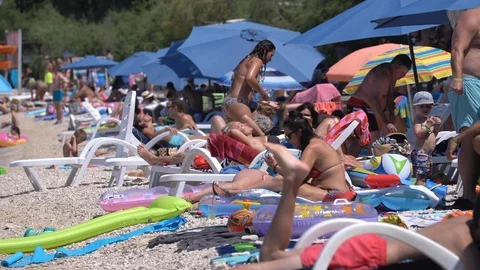 Crowded mediterranean beach in Croatia - July 2018: Adriatic sea, Brac Island Stock Footage 93547853