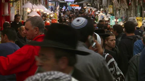 Crowded narrow marketplace in Jerusalem, people passing close to camera Stock Footage 59453467