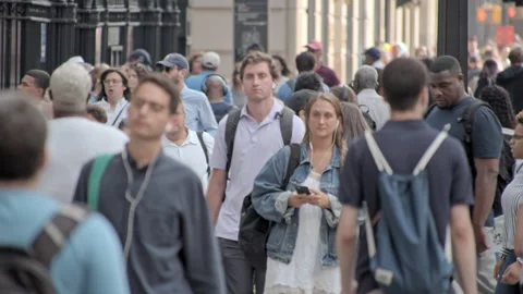 Crowded New York City sidewalk, people walk going to work, busy urban street Stock Footage