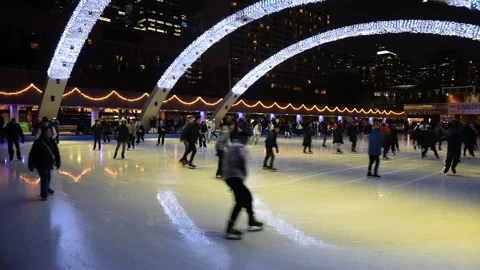 Crowded night ice skating scene at Nathan Phillips Square Stock Footage 330859547