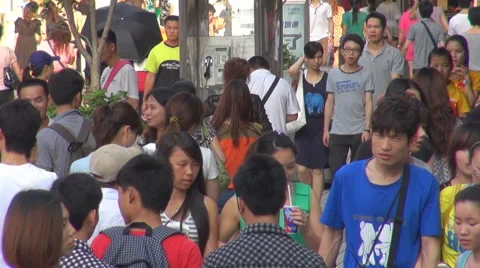 Crowded people commute sidewalk traffic road street Shenzhen pedestrian transit  Stock Footage 46968626