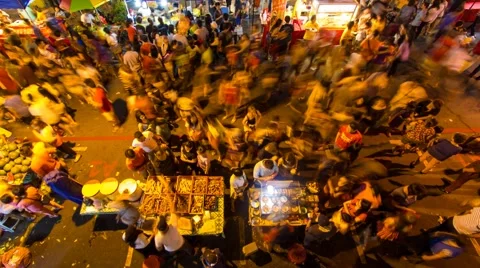 Crowded people in motion at night market timelapse Stock Footage