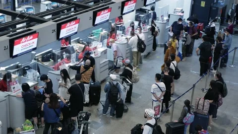 Crowded people passenger lines in airport waiting and check at check in cou.. Stock Footage 229485820
