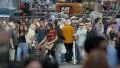 Crowded people walking chaotic street traffic Times Square NYC New York City day 4k or 4k+ Resolution