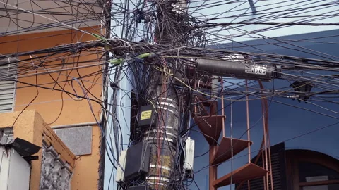 Crowded power lines in a messy junction of wires in a typical slam scene. Stock Footage 138607863