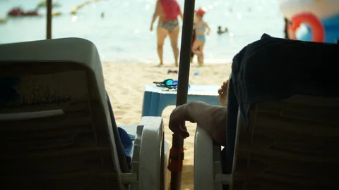 Crowded sand beach scene with unrecognizable tourist people. blur, 4k, slow Stock Footage 86709413