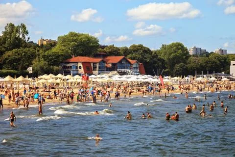 Crowded sandy beach Stock Photos