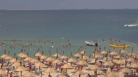 Crowded sandy beach in summer hot day tourist people enjoy sea water relax fun Stock Footage 72252446