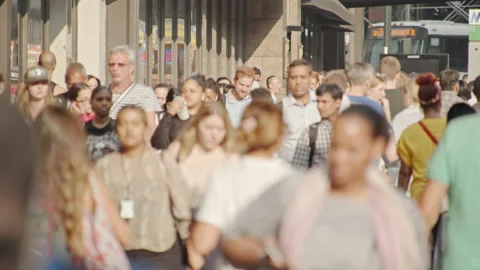 Crowded street in NYC, commuters rush hour cityscape, people walk, sunny day Stock Footage