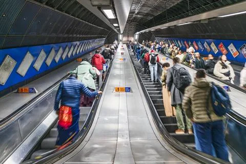 Crowded subway escalator filled with commuters in metro station. London, UK, 29 Stock Photos