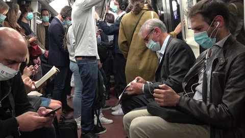 Crowded subway rush hour Paris France, Covid-19 coronavirus face masks Stock Footage 139763061