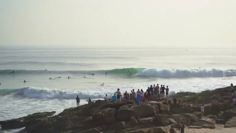 Crowded surf spot anchor point in taghazout and people watching from the shore Stock Footage 296686287