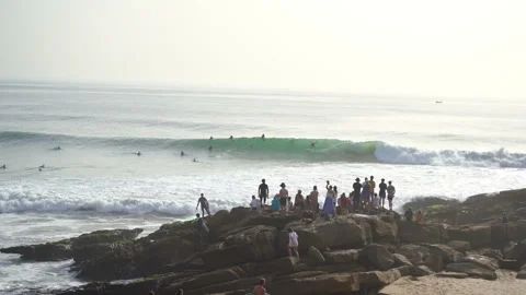 Crowded surf spot anchor point in taghazout and people watching from the shore Stock Footage 296686909