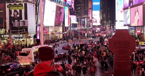 Crowded times Square at night in Manhattan, New York City. Bright displays Stock Footage 219880671