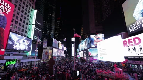 Crowded Times Square night scene in New York City, New York with bright digital Stock-Footage 324620137