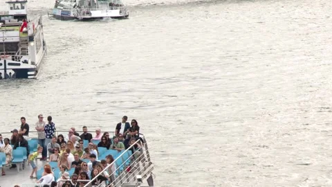 Crowded Tourist Boat Passengers Sightseeing on the Seine River in Paris 動画素材 341908471