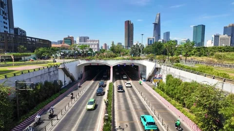Crowded traffic exits Thu Thiem tunnel in the morning Stock Footage 295243270