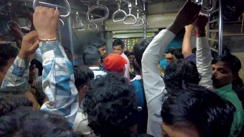 Crowded train rush during Office  Peak Hours. 4K (Real Time). Video stock 252885224