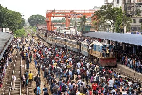 Crowded Train Station With Packed Platform And Long Trains Stock Photos