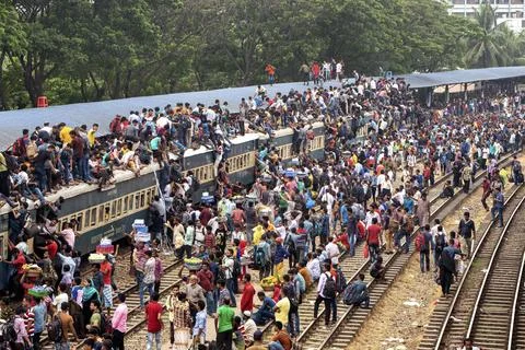 Crowded Train Station With Packed Platform And Long Trains Stock Photos