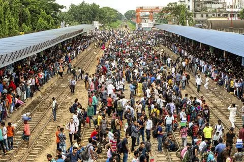 Crowded Train Station With Packed Platform And Long Trains Stock Photos