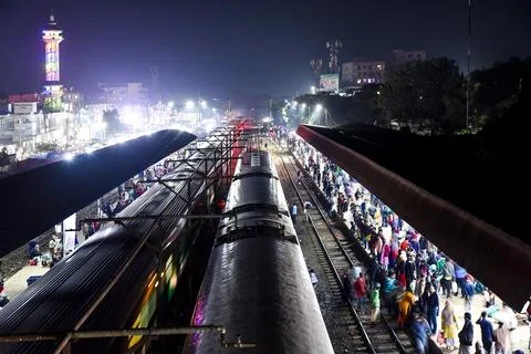 Crowded Train Station Platform at Night with Illuminated Surroundings Stock Photos