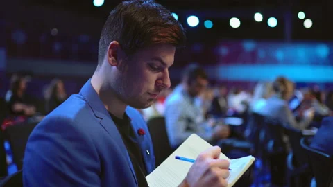 Crowded viewer seminar writed copybook. Audience group business man write paper. Stock Footage 139313456