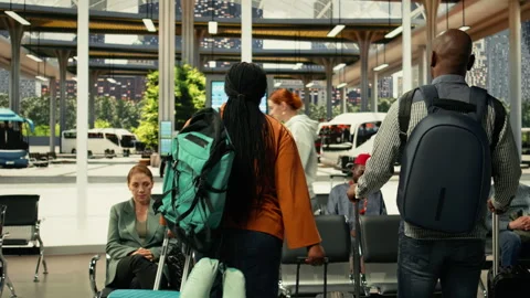 Crowded waiting area in modern bus terminal filled with diverse passengers Stock Footage 334723648