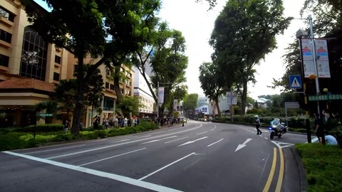 Crowds and security awaiting Kim Jong-Un's motorcade Singapore, Trump-Kim summit Stock Footage 90900030