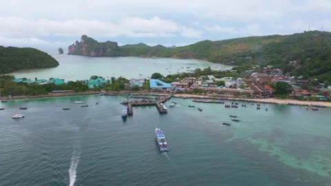 Crowds await ferry on vibrant Phi Phi shore, Thailand Stock Footage 307438639