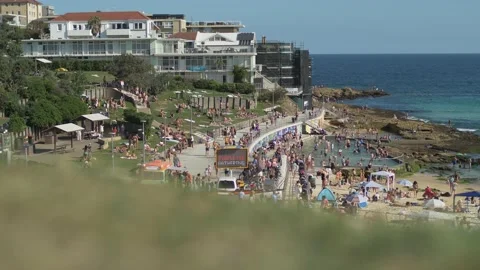 Crowds at  Bondi rock pool with Covid sign slow motion 4K Stock Footage 150288786