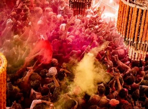 Crowds can be seen below duirng Holi Festival in India, throwing powdered paint Stock Photos