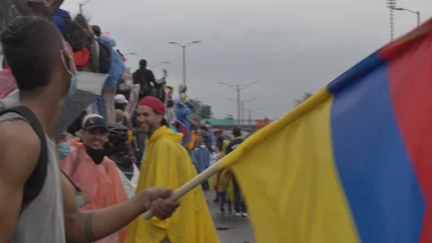 Crowds In Colombia Protest Against Government Tax Politics Under Rain Stock Footage
