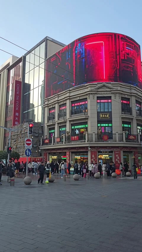 Crowds at Corner Building With Red LED Screen, Shanghai, China – Vertical 8K Stock-Footage 299015164