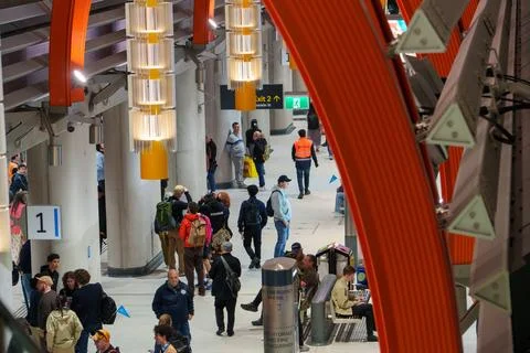 Crowds exploring the modern architecture of State Library Station on Metro .. Stock Photos