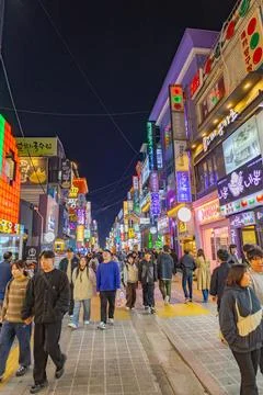Crowds Exploring a Vibrant Night District in Suwon, South Korea Stock Photos