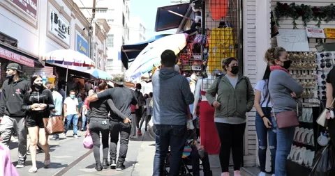 Crowds in face masks flock to Santee Alley as Los Angeles begins to reopen Stock Footage 153504271