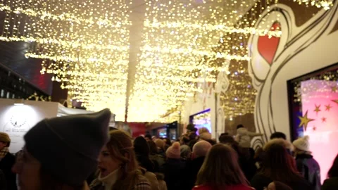 Crowds at Galeries Lafayette Paris Dec 2 2023 admire festive windows and lights Stock Footage 314891978