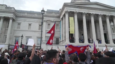 Crowds gather at Trafalgar Square to protest the Nepalese government following  Stock Footage 316705166