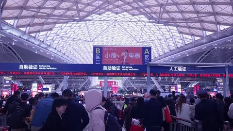 Crowds inside Guangzhou South Train Station before Chinese New Year, 4K Video stock 264763105