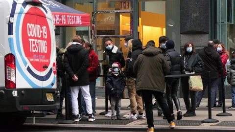 Crowds line up at COVID Testing Site Stock Footage 167756959