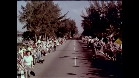 Crowds line the streets to welcome return of astronaut John Glenn Stock Footage 262065075